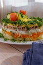 Mimosa Salad. Layers of carrots, fish, potatoes and grated hard-boiled egg, covered with mayonnaise