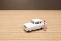 a min figures of a lady and car Royalty Free Stock Photo
