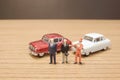 the min figures of a people and car Royalty Free Stock Photo