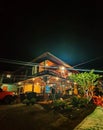 Minahasa traditional house glowing in the middle of the night