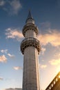 Minaret against the background of the sunset sky Royalty Free Stock Photo