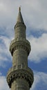 Minaret of The Blue Mosque Istanbul Turkey against a cloudy sky Royalty Free Stock Photo