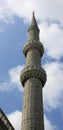 Minaret of The Blue Mosque Istanbul Turkey against a cloudy sky Royalty Free Stock Photo