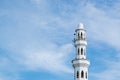 minaret and dome of Tengku Tengah Zaharah Mosque with blue sky background Royalty Free Stock Photo