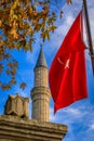 Minaret of the Hagia Sophia Grand Mosque with a Turkish flag, Istanbul, Turkey Royalty Free Stock Photo