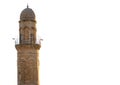 Minaret of a historical mosque in mardin turkey and white background Royalty Free Stock Photo