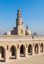 Minaret Ibn Tulun Mosque with helical outer staircase and dome of Amir Sarghatmish mosque, Cairo, Egypt Royalty Free Stock Photo