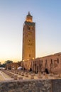 Minaret of Koutoubia Mosque with Ruins of Old Mosque at sunrise