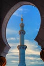 Minaret of Mosque, Abu Dhabi, United Arab Emirates. Typical sunset sky with colorful clouds Royalty Free Stock Photo