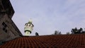 minaret of mosque in Jakarta viewed from below and blocked by house roof Royalty Free Stock Photo