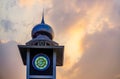 Minaret or mosque tower under the orange sky, for islamic new year greetings or ramadan kareem