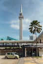 Minaret with palm trees. The National Mosque of Malaysia is a mosque in Kuala Lumpur, Malaysia.