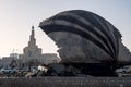 The minaret of Qatar Islamic Centre in the centre of Doha, seen through the Oyster fountain feature on the Corniche. Royalty Free Stock Photo