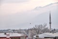 Minaret seagull and heavy foggy ulu mountain (uludag)