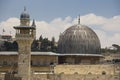 A minaret and the silver dome of the Al Masjid Al Aqsa Mosque