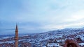 Minaret, stone houses and caves at Uchisar region in Cappadocia in Turkey Royalty Free Stock Photo