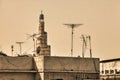 Minaret tower of mosque over roofs middle east Qatar