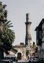 Minaret tower on the sunny street of old town Kaleici, Antalya, Turkey