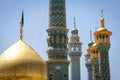 The minarets, the dome and the details of the decorations of the magnificent Iranian Persian mosque Fatima Masumeh Shrine in blu