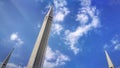 Minarets of Faisal mosque with blue sky and light white clouds in Islamabad, Pakistan