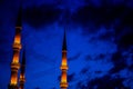 Minarets rising through the blue night of Istanbul, Turkey