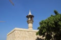 Minarette of Mosque, a green tree and cranes in the city of Beirut, Lebanon