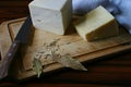 Minas cheese with dried leaves and dried rosemary with blue filter.