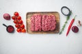 Mince. Ground meat with ingredients for cooking, on white background, top view flat lay with copy space for text