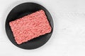 Mince. Ground meat on white wood background. Top view