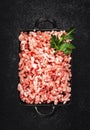 Mince, ground minced meat with ingredients for cooking on black background. Top view, copy space
