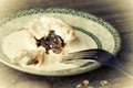 Mince pies and cream with a fork on a plate. Royalty Free Stock Photo