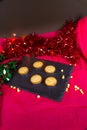 Mince pies in a slate mat at Christmas, portrait Royalty Free Stock Photo