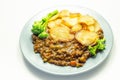 Minced beef hotpot, tender british beef in a warming gravy with carrots and peas, all topped with sliced roast potatoes Royalty Free Stock Photo