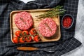 Minced meat burger cutlets. Gray background. Top view Royalty Free Stock Photo