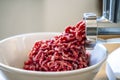 Minced meat and electric meat grinder. Cooking beef minced in the kitchen with an electric grinder Royalty Free Stock Photo