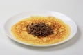 Minced meat filling on a large thin pancake