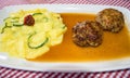 Minced meat patties with cucumber potato salad