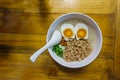 Minced pork congee with egg Royalty Free Stock Photo