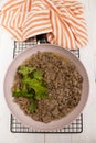 Minced pork meat with parsley and oil in a pan Royalty Free Stock Photo
