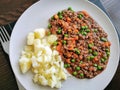 Minced and tatties with a fork on a plate. Traditional Scottish food.