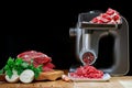 Mincer electric with fresh minced meat.