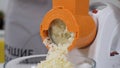 Mincer machine cuts vegetable in kitchen. White electric mincer machines for minced meat per minute, make sausages