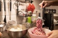 Mincer machine with fresh chopped meat at home kitchen. Preparing ground meat