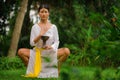 Mind and body connection - beautiful and happy healer Asian woman holding incense cup doing ritual traditional healing dance at