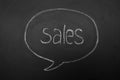 Mind or dialogue Bubble on chalkboard with the inscription sales . Handwrite word. Royalty Free Stock Photo