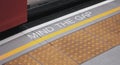 Mind the gap sign. text on train station platform