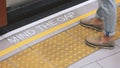 Mind the gap sign. text on train station platform