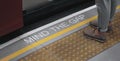 Mind the gap sign. text on train station platform