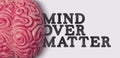 Mind Over matter word next to a human brain model