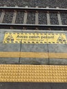 Mind the Platform Gap Warning Sign at Train Station Royalty Free Stock Photo